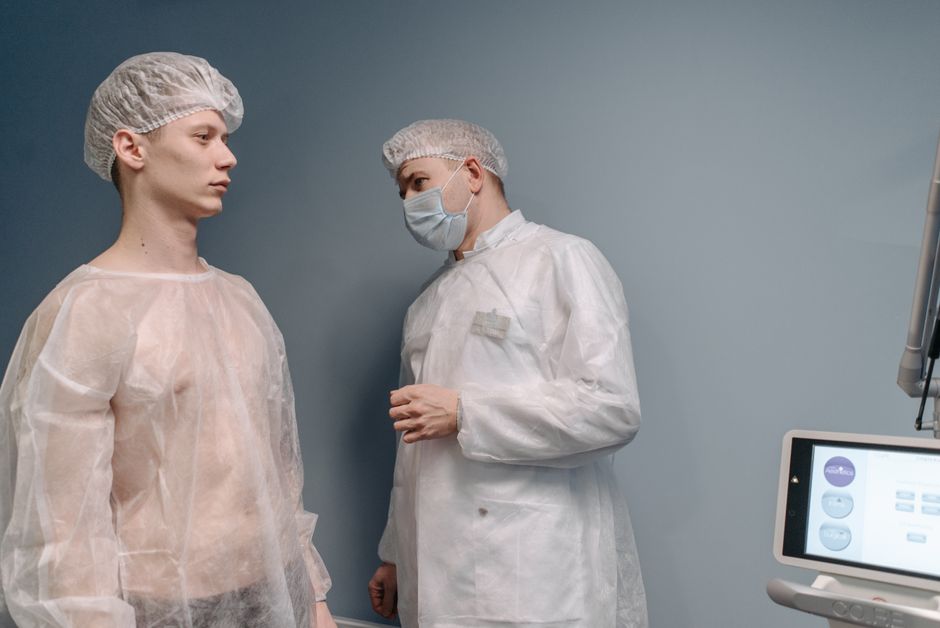 Dermatologist examining a patient's moles in a clinic to detect early signs of skin cancer.