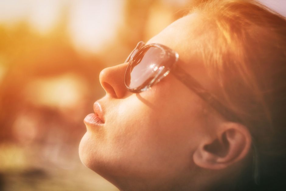 Close-up of healthy skin in natural sunlight reflecting a fresh, even complexion