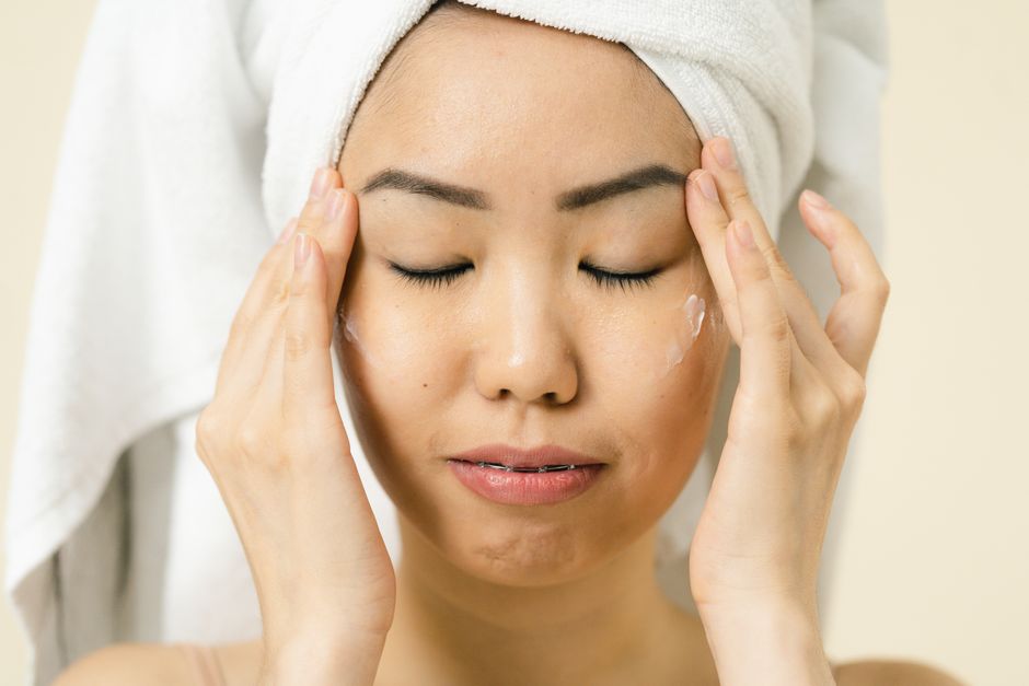 Close-up of a person's calm, clear complexion in soft natural light